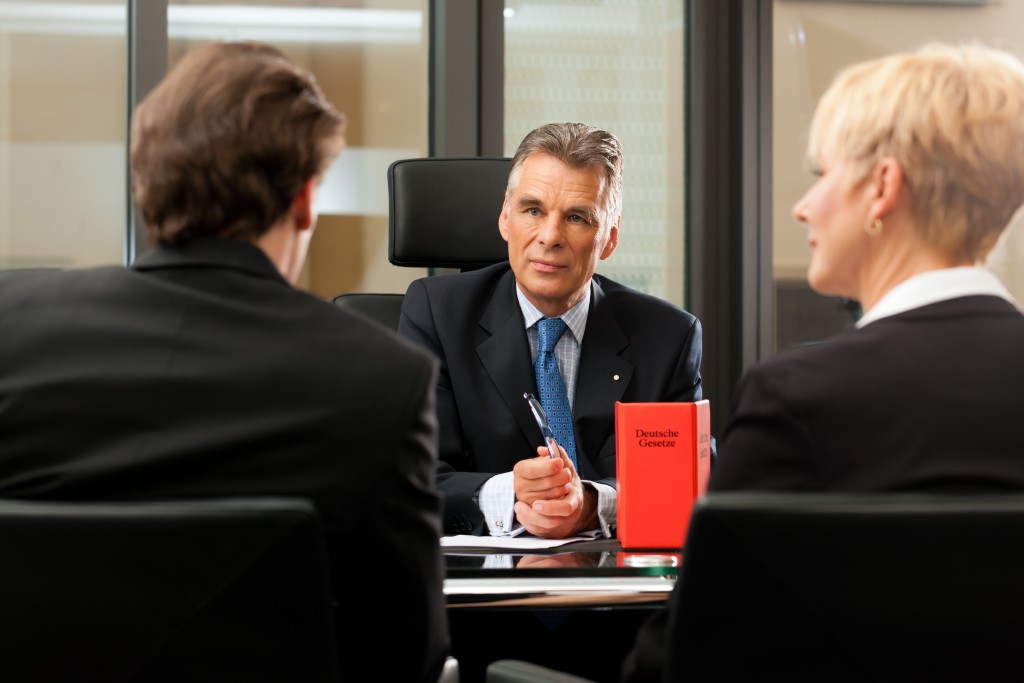 Two clients in front of lawyer