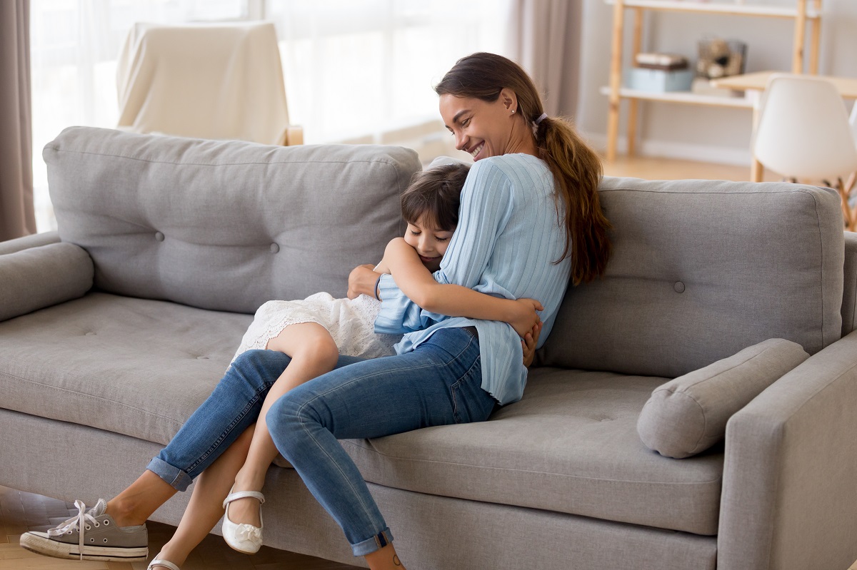 mother and daughter hugging each other