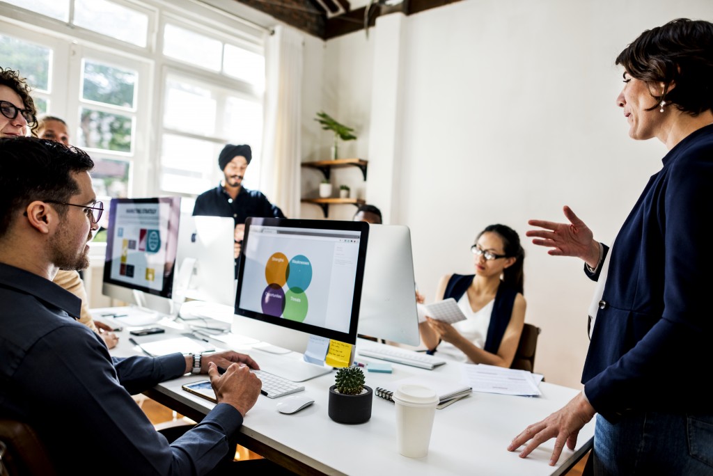 business meeting with computers in the room