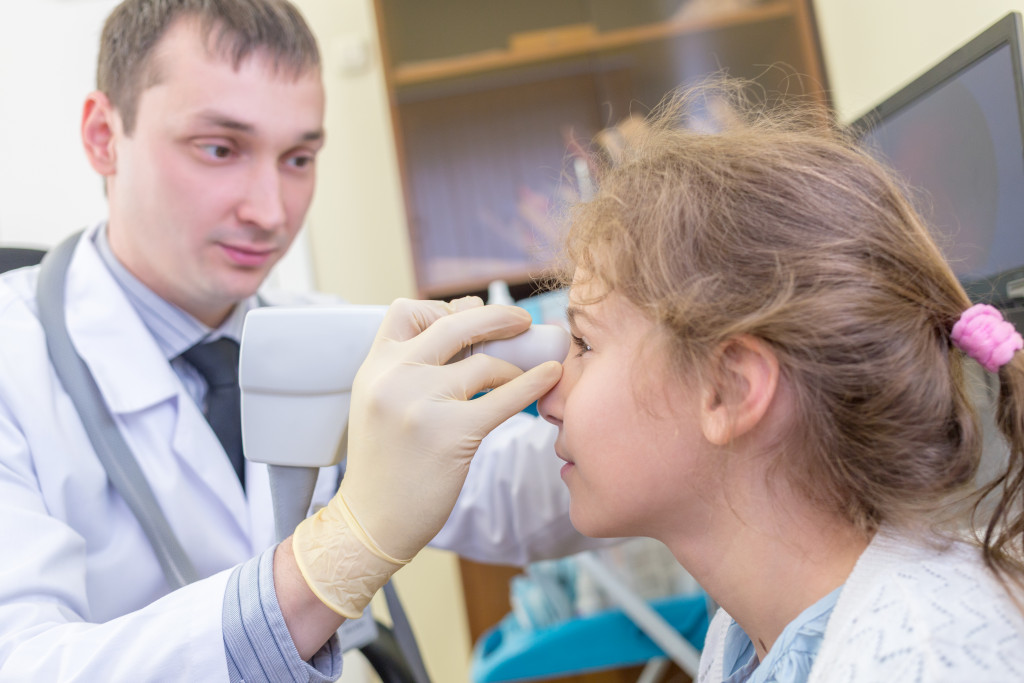 examining eye