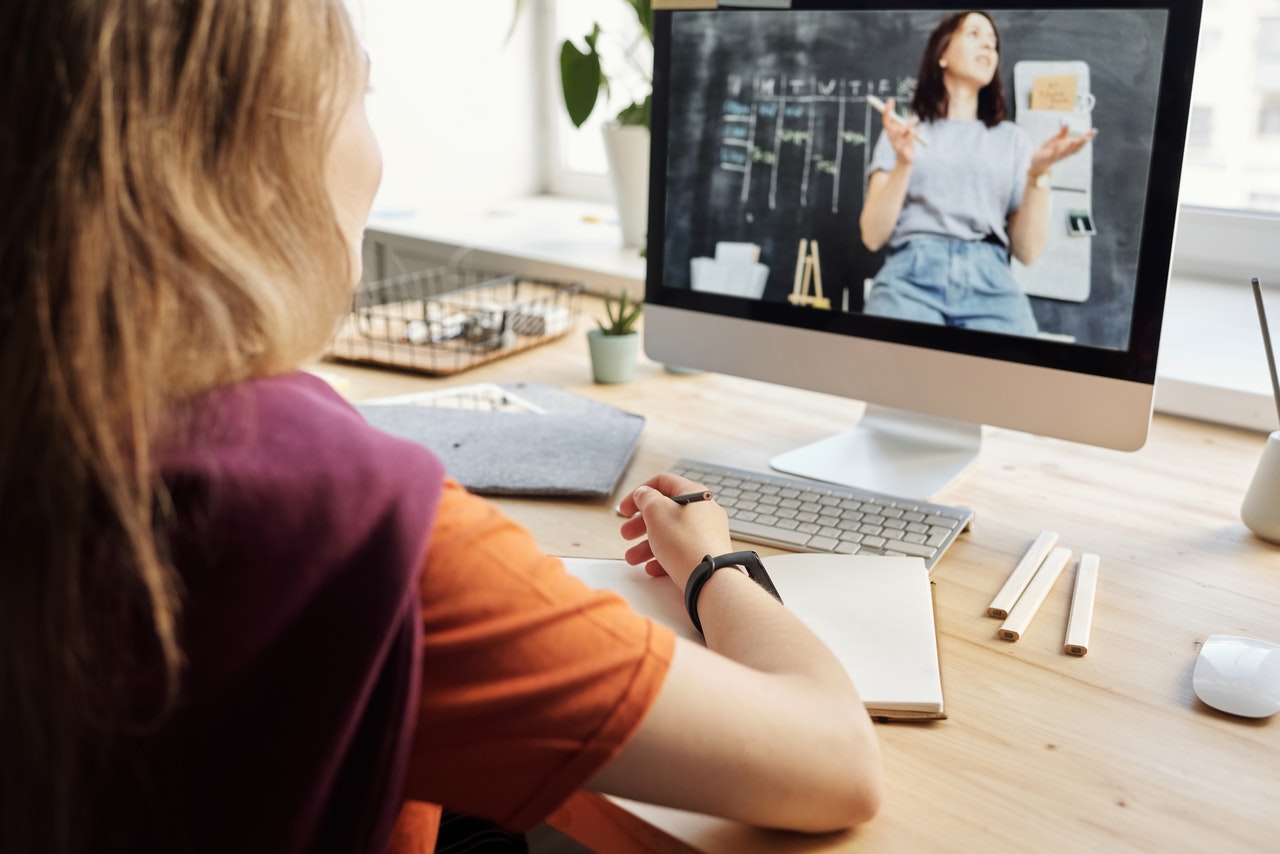 young girl attending online class