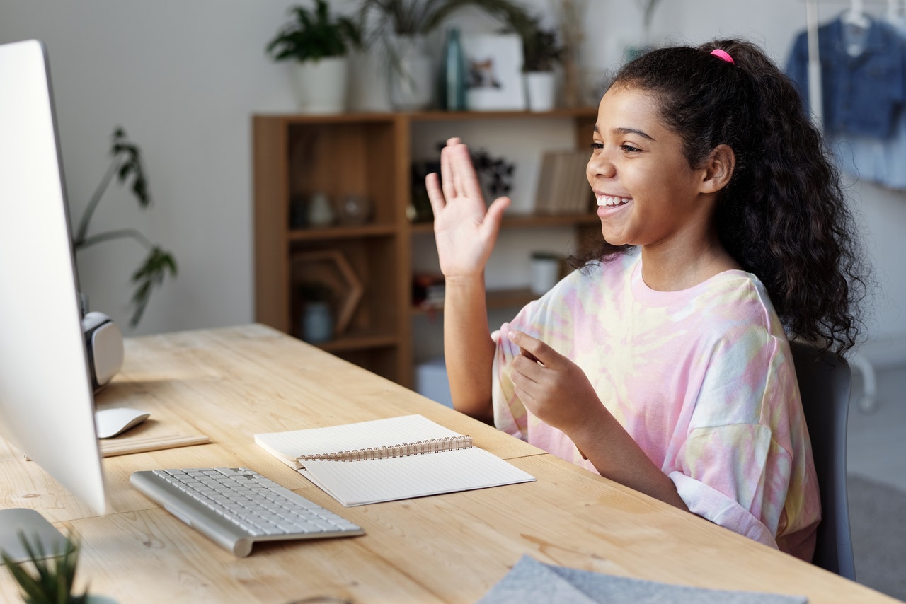 young girl attending online classes