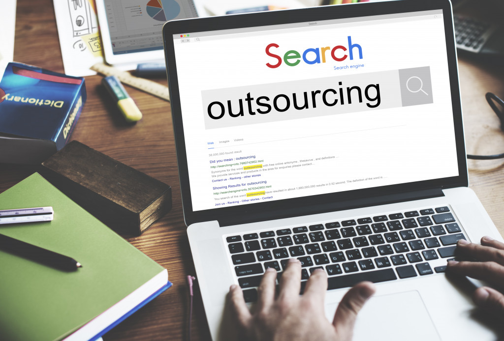 business owner googling 'outsourcing'