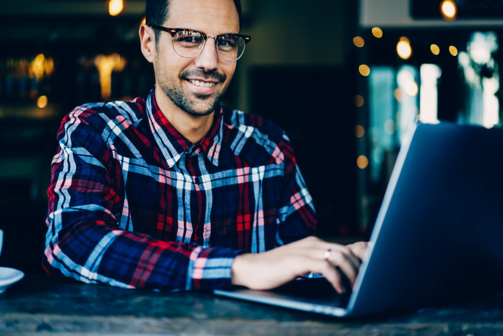 Man typing on laptop