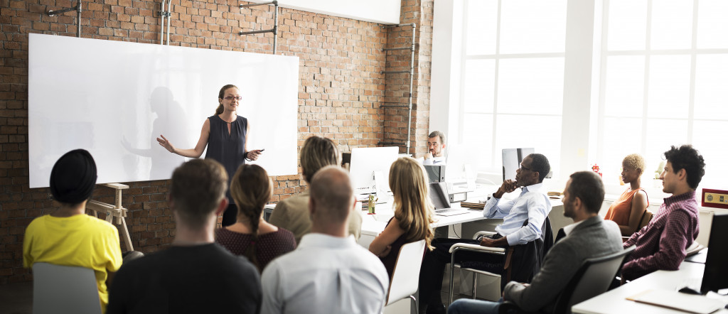 employees listening to a speaker