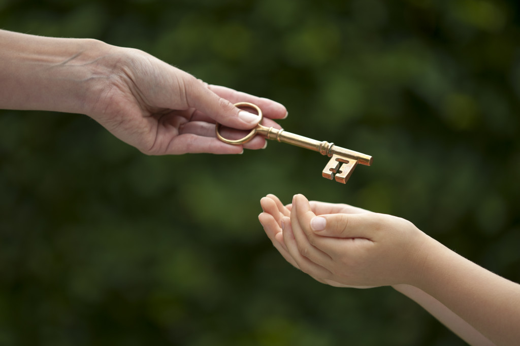 mother handing over key