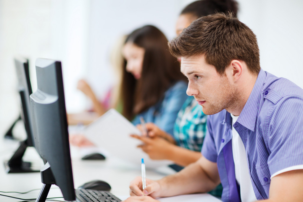 college student using computer for studies