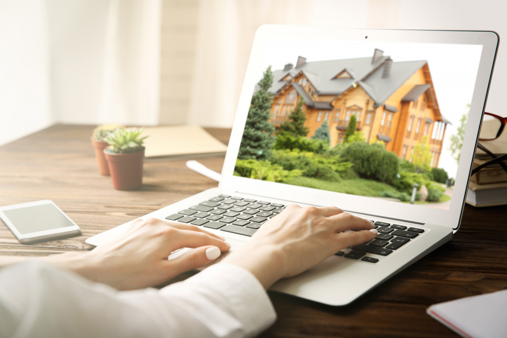 a person choosing a home via online
