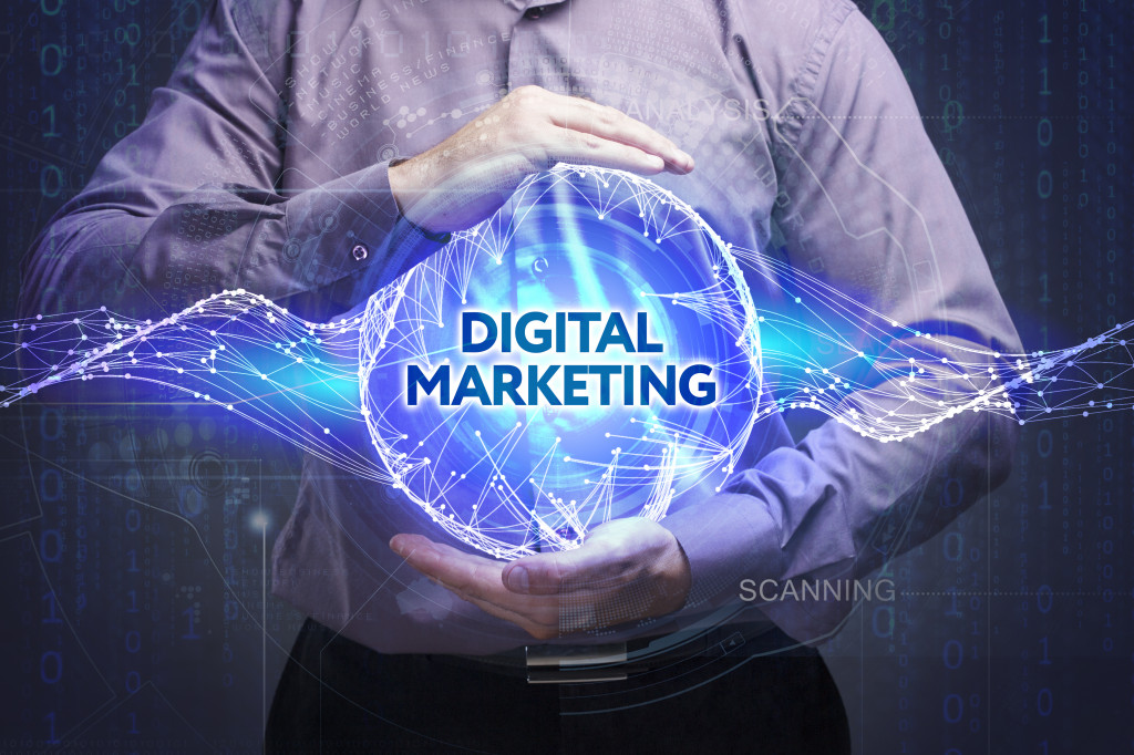 digital marketing concept with businessman holding the word