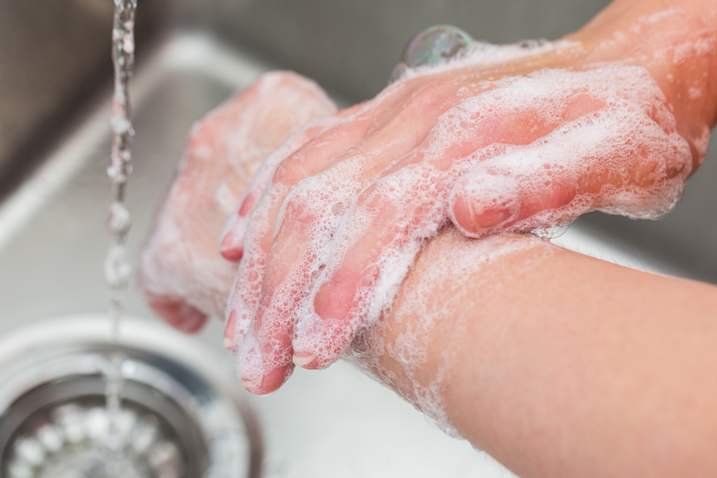 A person washing their hands