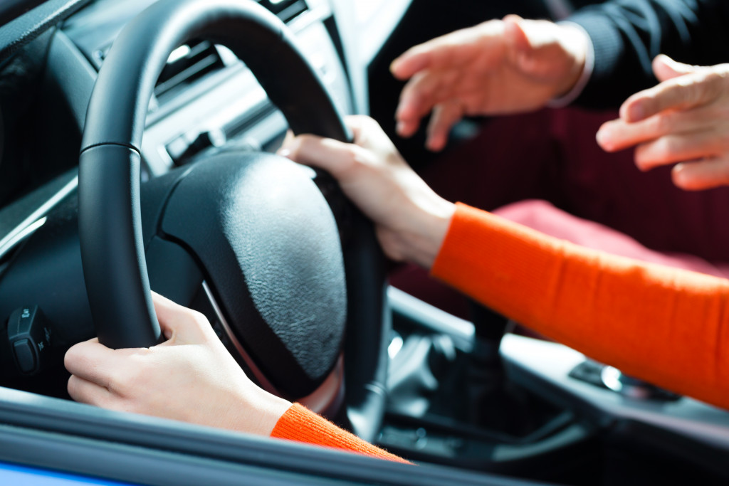 A woman getting driving lessons