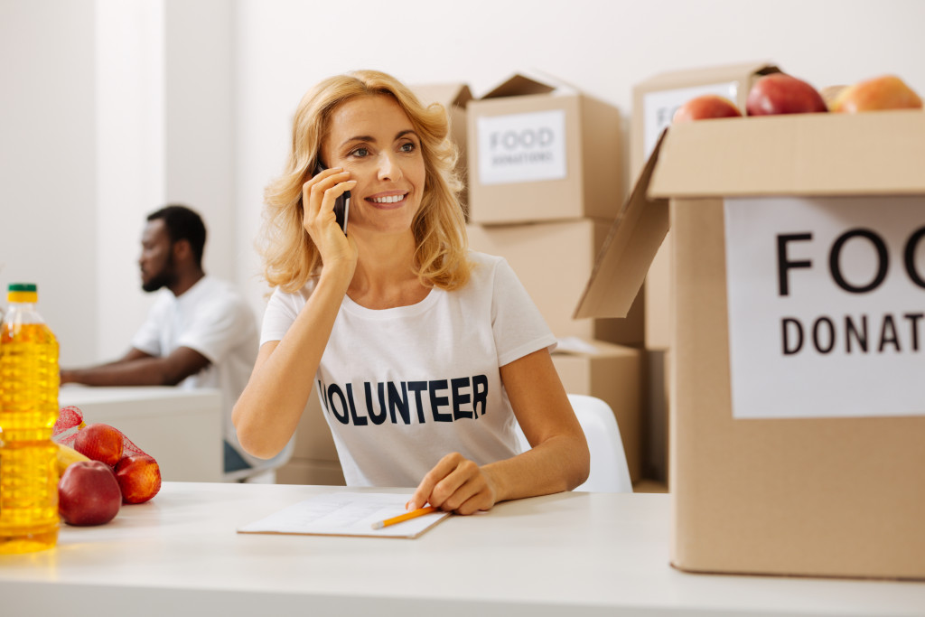 female volunteer contacting investors and other institutions for donations