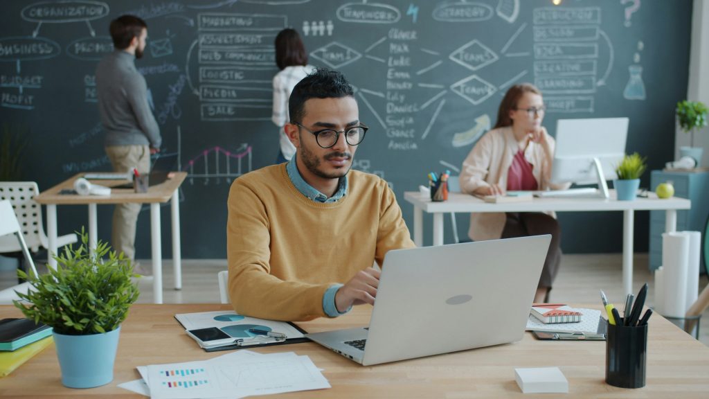office employees working on laptops