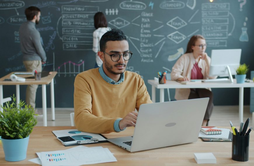 office employees working on laptops